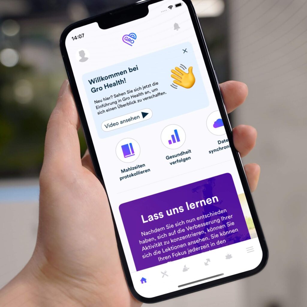 Das Bild zeigt ein Handy mit der Gro Healt App auf dem Bildschirm
